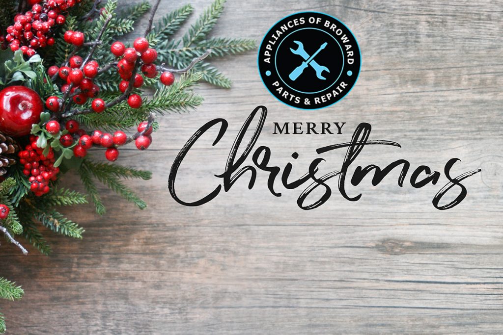 Merry Christmas graphic with festive greenery, red berries, and an apple, featuring Appliances of Broward logo for holiday greetings.